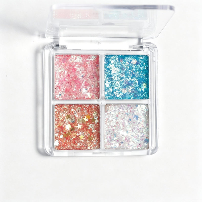 Four-color glitter palette open, showing all pressed glitter pans with star and chunky flakes