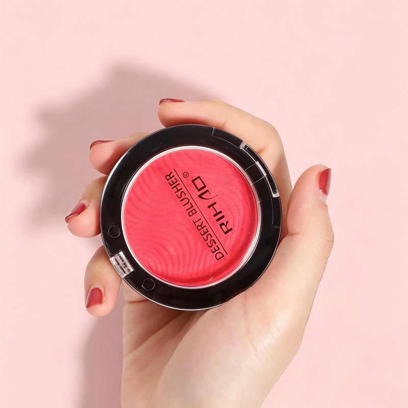 Rihao Dessert Blusher coral red compact held in hand showing wavy texture pan